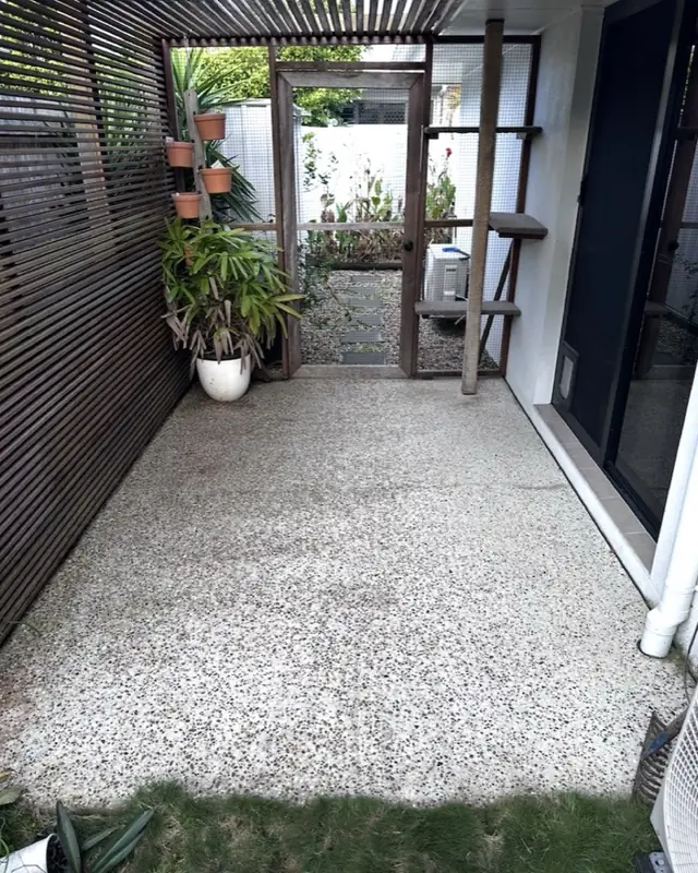 A pergola-covered patio floor clean and even after pressure washing
